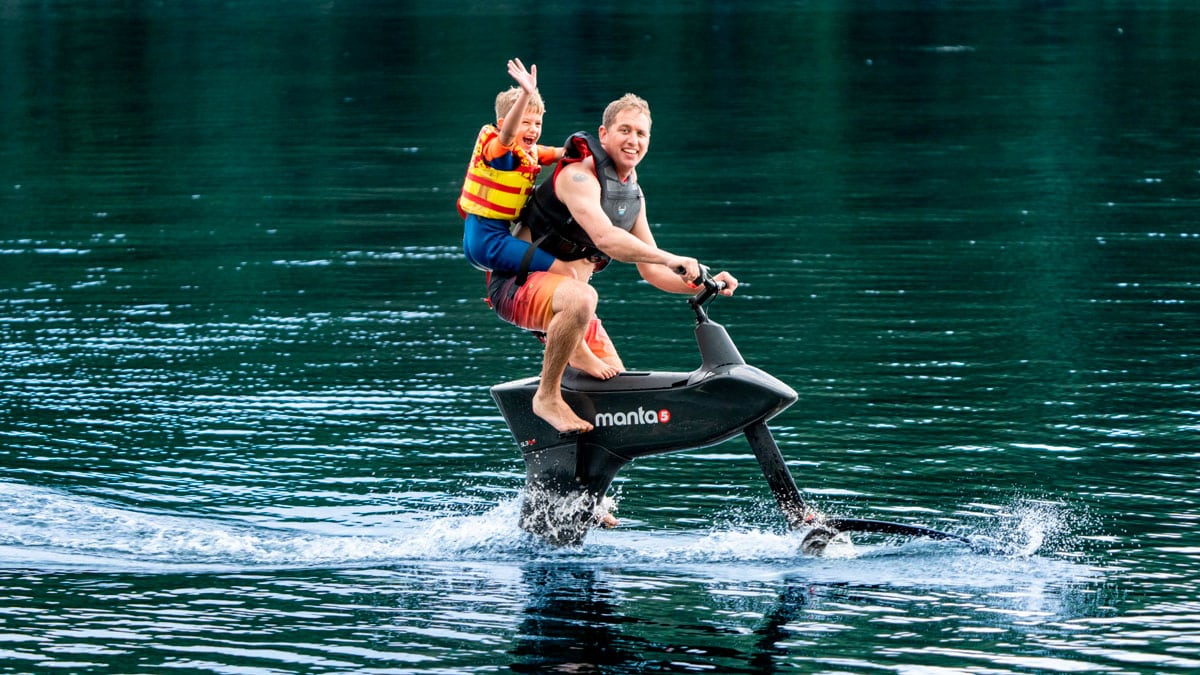 Father and son riding the hydrofoiler SL3 waterbike