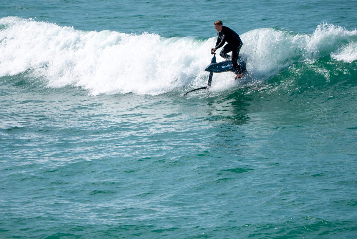 Man riding the Hydrofoiler SL3 pro on the waves