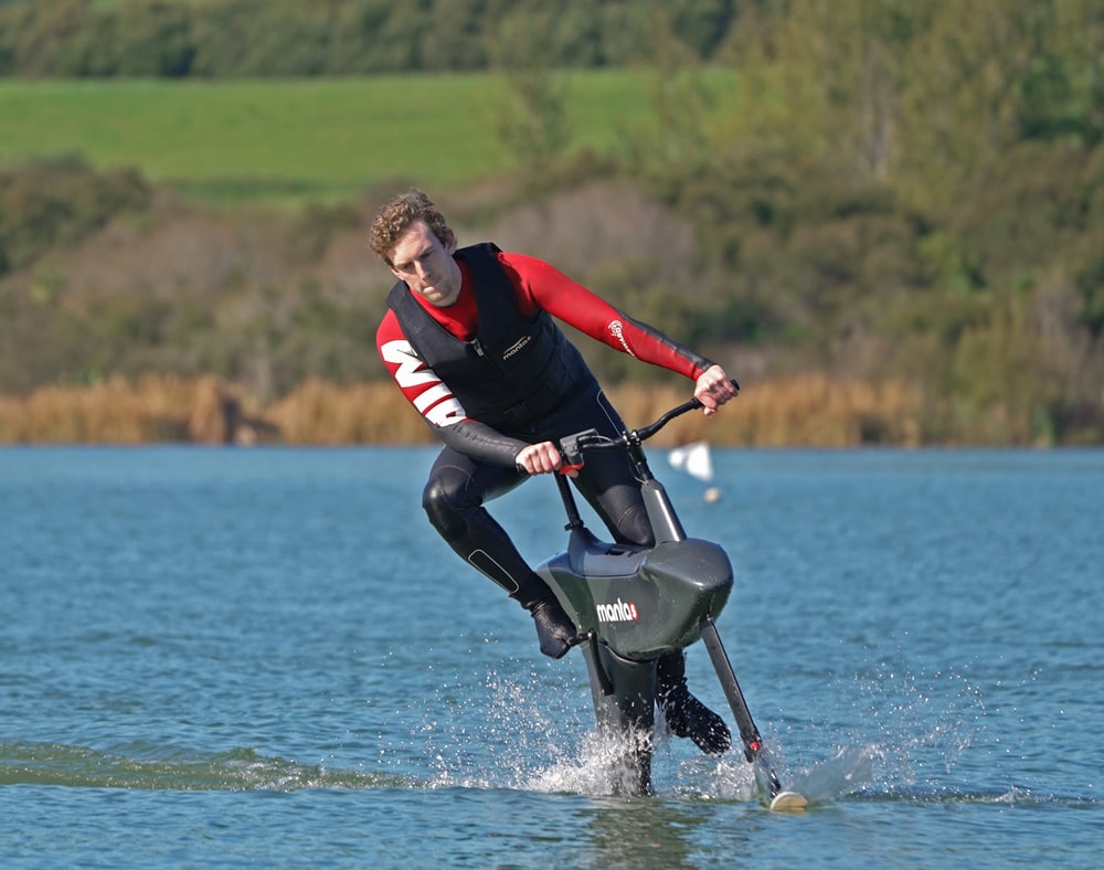 male taking a turn while riding the hydrofoiler SL3 water bike